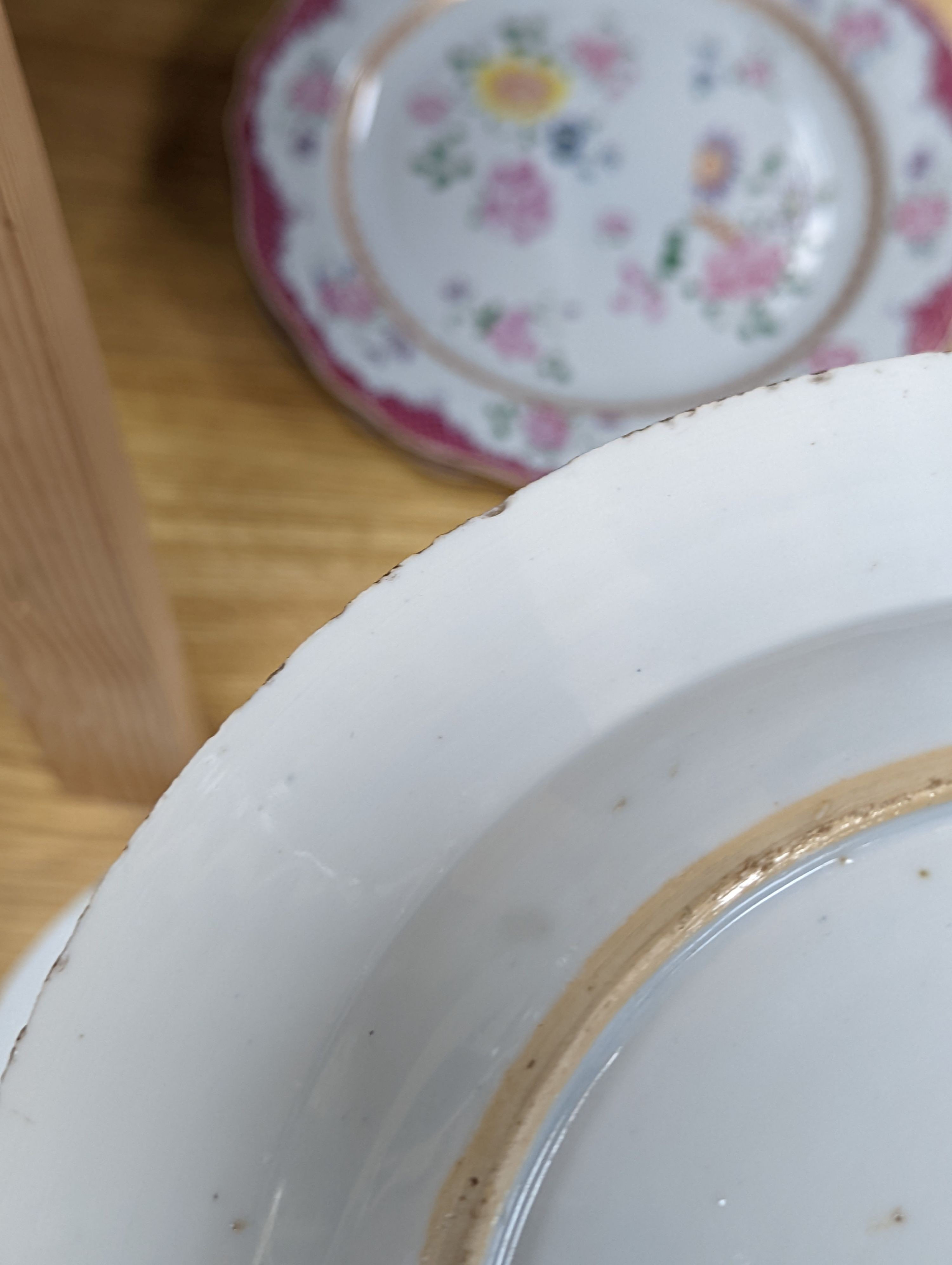 Two pairs of 18th century Chinese famille rose plates and an Imari plate, 26cm